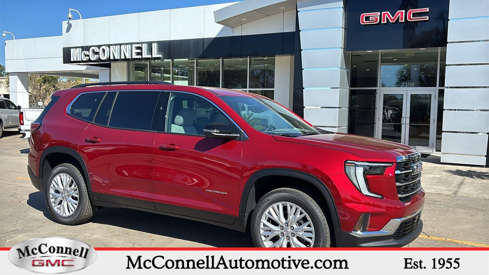 2026 GMC Acadia Elevation in Volcanic Red Tintcoat — front three-quarter view