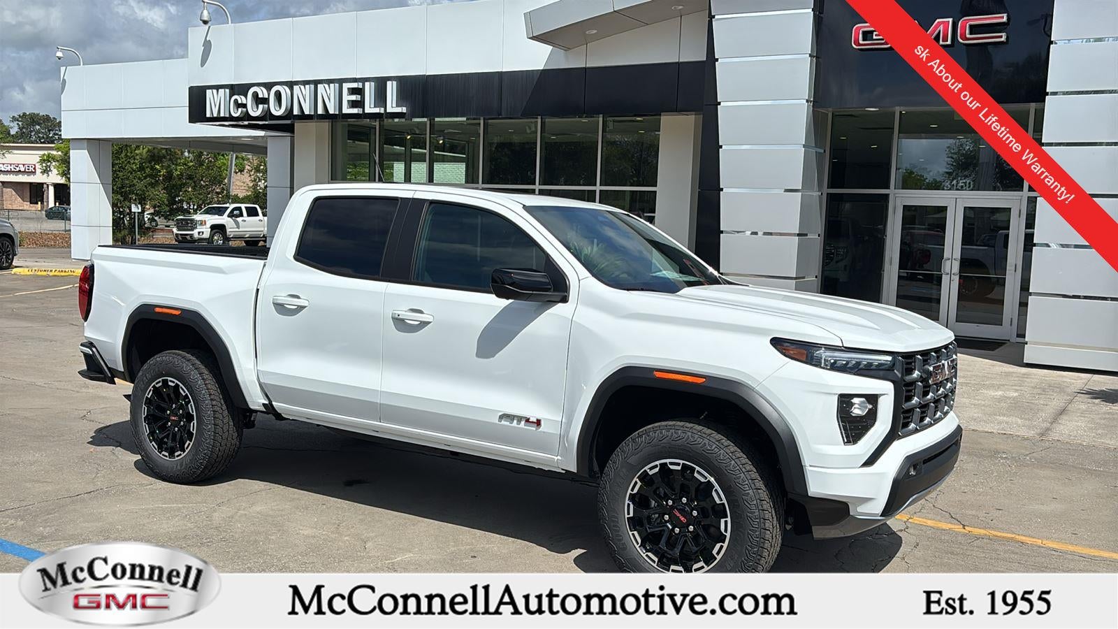 2026 GMC Canyon AT4 in Summit White — front three-quarter view