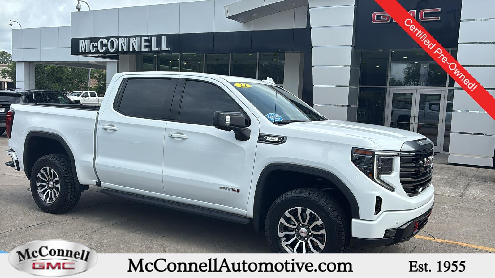2022 GMC Sierra 1500 AT4 in Summit White — front three-quarter view