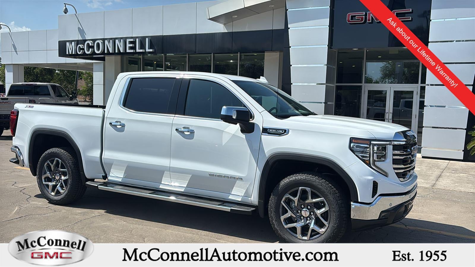 2026 GMC Sierra 1500 SLT in Summit White — front three-quarter view